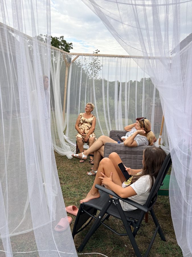 Visitors listening inside the Solfeggio Tent during the day, MAMA's House, Belezna